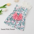Pink floral print puppy dress with a large decorative bow on a white cotton base - Pink Floral