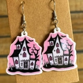 Detail of cute Halloween haunted house earrings in pink and black acrylic on cardboard - Haunted House