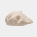 Gedetailleerde textuur van hoogwaardige beige wollen baret met zachte stof en steel - Beige