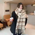 Plaid mohair scarf in beige and brown check with fringes, modeled in a cafe setting - Milk Tea