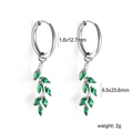 Macro view of silver leaf earrings with green marquise stones and detailed size markings - Silver Olive Branch Zirconia Earrings