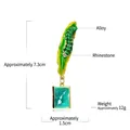 Caterpillar and green leaf enamel brooch with hanging book charm and crystal details - Caterpillar & Small Book (YNCP07178) / Emerald Green