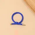 Close-up of royal blue elastic hair tie with simple knot and gold metal end caps - Ribbed Knot - Metal Buckle / Royal Blue