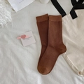 Deep brown cotton crew socks with vertical ribbed texture on white bedding backdrop - One Size / Brown
