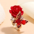 Bohemian gold-tone ring featuring a red rose, crystal butterfly, and central red gemstone - Red