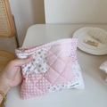 Detail of pink floral quilted pouch with simple wish label and silver metal zipper - Pink Grid Patchwork Floral