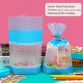 Sachet cadeau bleu à pois en matériau BOPP mat avec dentelle blanche et lien doré - Style à Pois Bleus - Petit