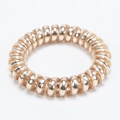 Champagne gold spiral telephone wire hair tie with metallic finish for women - Champagne
