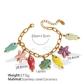 Pink starfish and colorful fish ceramic charms on a gold stainless steel chain bracelet - Ocean Fish Starfish Mixed Color Ceramic Bracelet (SL98)