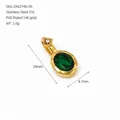 Gold plated stainless steel oval pendant with a green crystal and star detail. - May Dark Green Rhinestone