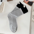 Grey and black patchwork crew socks with NT letter tag and ribbed cotton texture - One Size / Light Gray
