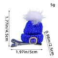 Blue knitted Christmas hat hair clip for kids featuring a heart-shaped blue gem and white pompom - Blue