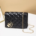 Chic black quilted crossbody bag featuring a golden chain strap and square metal lock - Black