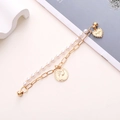 Close-up of double-layer bracelet with pearl chain, gold coin and heart charms - Portrait Coin Heart Artificial Pearl Double Layer Chain (K250)