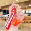 Astronaut red liquid quicksand bubble tea keychain with red Good Luck wristband - Red Milk Tea Cup Quicksand-Fortune Plate