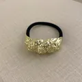 Elastic hair tie with irregular hammered golden geometric metal piece in minimalist style - Twisted Wrinkle Gold