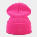 Detailed embroidery of a sun motif on a vibrant hot pink knit beanie hat - Light Rose