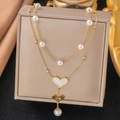Double-layer stainless steel necklace with pearls and heart fringe pendant on jewelry box - Two Hearts Double Chain Necklace - Gold