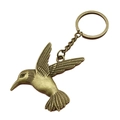 Llavero de colibrí de metal bronce vintage con colgante de pájaro en fondo blanco - Bronce Antiguo