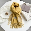 Detail of yellow and beige double-sided scarf with tassels and stitched brand label - Bright Yellow