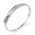 Silver stainless steel zipper bangle with zircon pavé details on a white background - White Gold