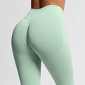 Detail of mint green seamless high waist yoga leggings with scrunch butt lift texture - Palm Green