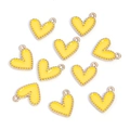 Macro view of 10-piece yellow enamel heart charms with gold-plated alloy edges - Heart-shaped Beaded Style / Yellow
