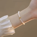 Elegant freshwater pearl bracelet for women featuring a gold heart charm on white pearls - Natural Freshwater Pearl Bracelet