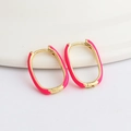 Detailed view of U-shaped oval hoop earrings featuring pink enamel and gold plating - Rose Red