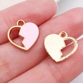 Pink enamel heart pendant with gold hollow heart charm shown on fingertips - Pink Half-face Heart (11885)