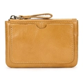 Close-up of vintage brown leather wallet showing grain texture and exterior card slot - Oil Leather Tan