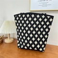 Macro detail of high-quality knit texture and geometric pattern on the shoulder tote bag - 22 Woven Pattern Black Beige