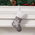 Grey Christmas mini stocking with snowflake pattern and white faux fur trim hanging on mantle - Gray Snowflake Style