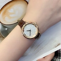 Women's watch with gold crystal-studded dial and brown leather strap on wrist - Rose Gold Case Coffee Leather
