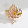 Exquisite maple leaf brooch with pink and white rhinestones on a gold plated base - Gold (HC1138)