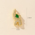 Close-up of gold elephant pendant with green and white stones measuring 2.4cm by 1.1cm - 0369-6 (Pave White Stone With Green Teardrop)