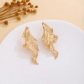 Detailed macro shot of vintage gold irregular wave-shaped dangle earrings on white display - E4991-2 Gold Ripple Style / Gold
