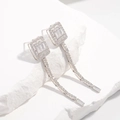 Macro shot of silver long fringe earrings with crystals on a textured white stone - Rectangular Geometric Tassel Style / Type A: White Gold (1 Pair)