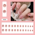 Sweet pink press-on nails model R486 featuring a full 24-piece set and wear demonstration - R486 Blush Glitter