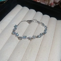 Luxurious silver bow bracelet with light blue oval gemstones on velvet jewelry tray - 3# Silver Blue Oval Style