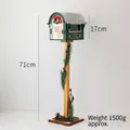Standing vintage Santa Mail box in dark green with wooden pillar and festive pine décor - Green Window Mailbox Style