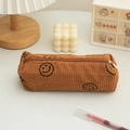 Caramel brown corduroy pencil case featuring black smiley face prints and a smooth zipper - Coffee Smile Face