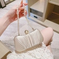Elegant beige pleated satin evening clutch bag featuring a pearl strap and gold pearl clasp - Apricot