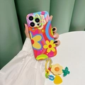 Detail view of iPhone Pro case with retro floral patterns and colorful charm chain strap - SJ5 Rainbow Graffiti + Yellow Flower Pendant / iPhone 15