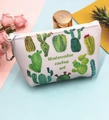 Flat lay of small PU leather cactus coin purse with zipper on pastel blue and pink backdrop - Cactus-3