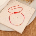 Close-up of woven seed bead bracelet with a white baroque pearl and red adjustable cord - 5# Red