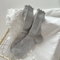 Light grey ribbed cotton mid-calf socks with elegant ruffled cuffs and wooden basket - One Size / Light Gray