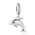 Macro shot of silver dolphin pendant with small clear crystals on a white background - Silver Polished Dolphin Zirconia Charm
