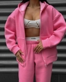 Close-up of pink zip-up hoodie and high-waisted jogger set with a soft cotton texture - Pink