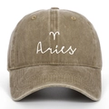 Close-up of Aries zodiac embroidery on vintage washed khaki cotton baseball cap - Khaki